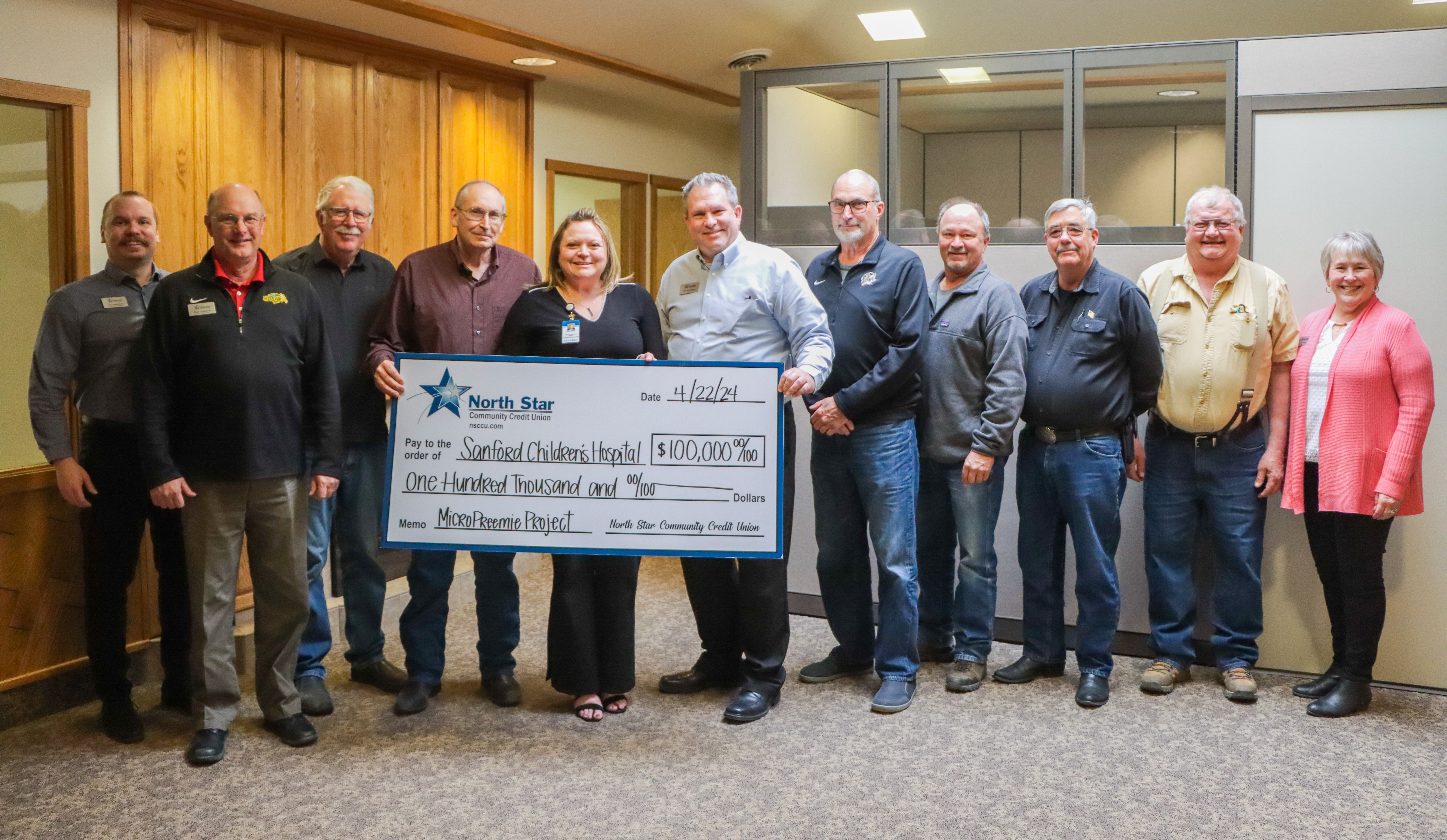 NSCCU representatives presenting check